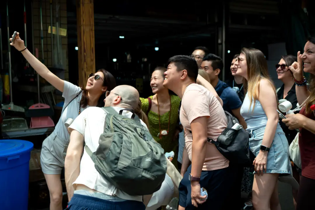 Group selfie at a local market