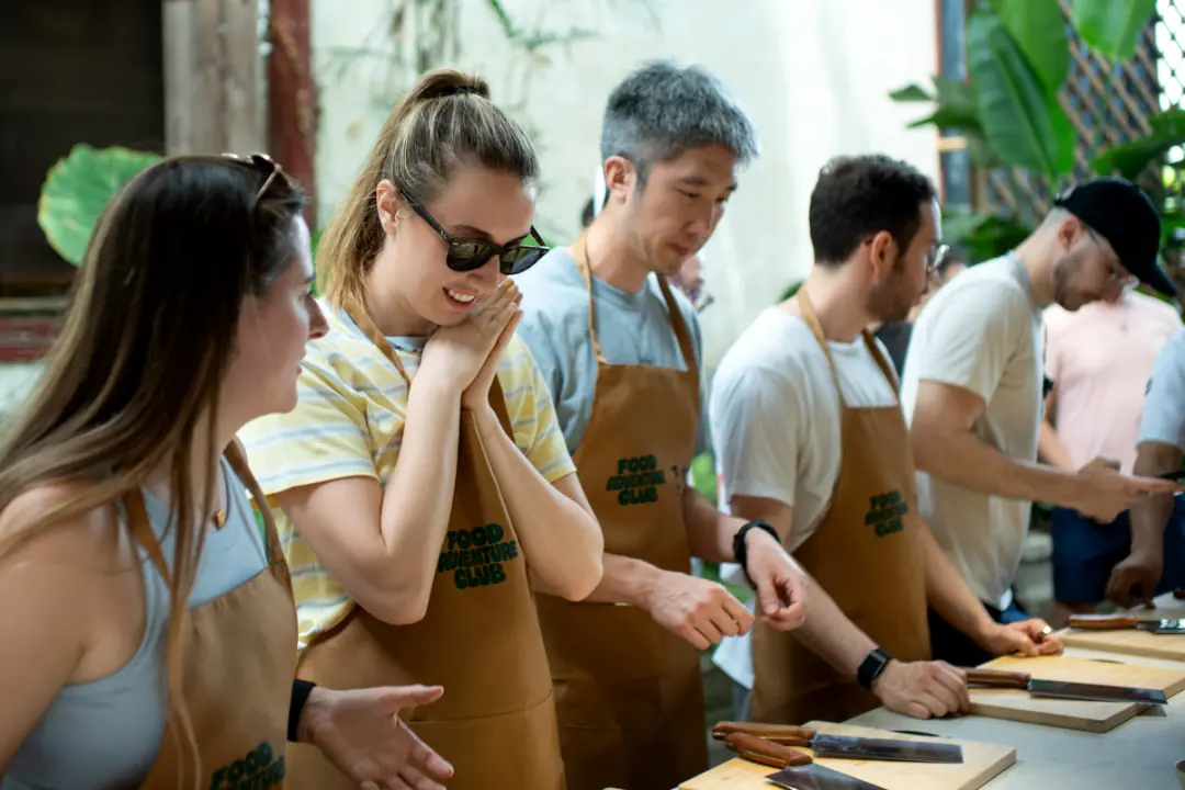 Guests in Food Adventure Club aprons