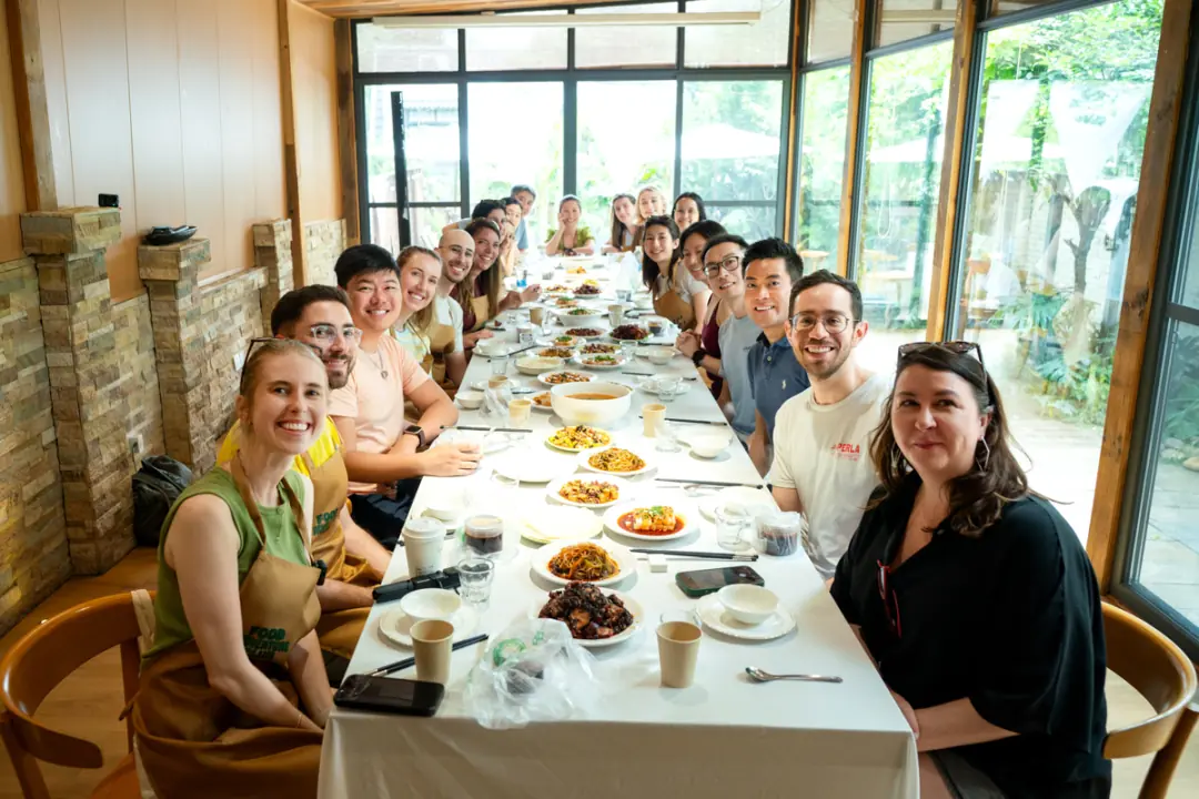 Group dinner around a long banquet table