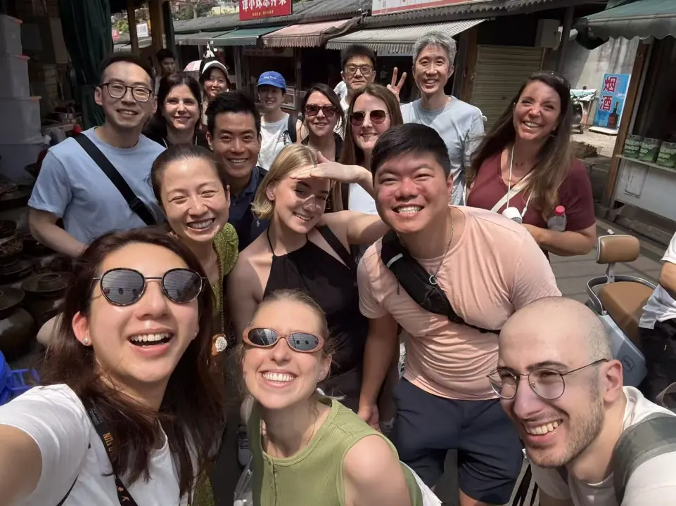 Southwest tour group selfie in a local market street