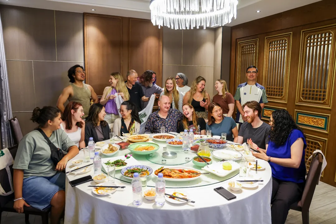 Full Southwest tour group portrait around a banquet table