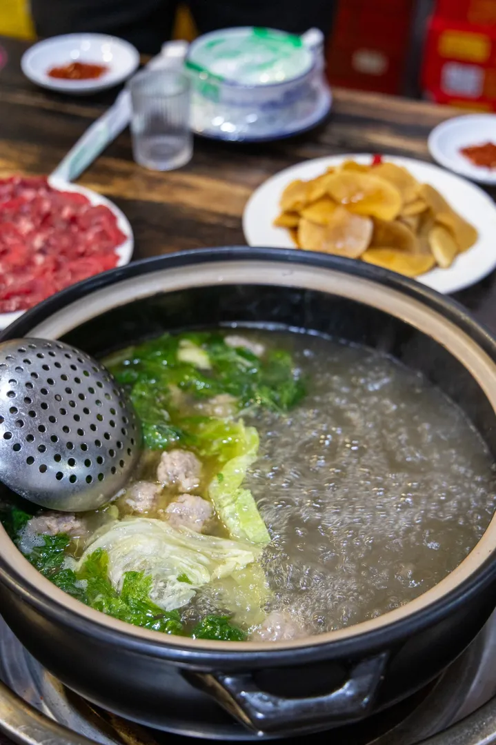 Bubbling Chongqing-style hot pot with sliced beef and potato